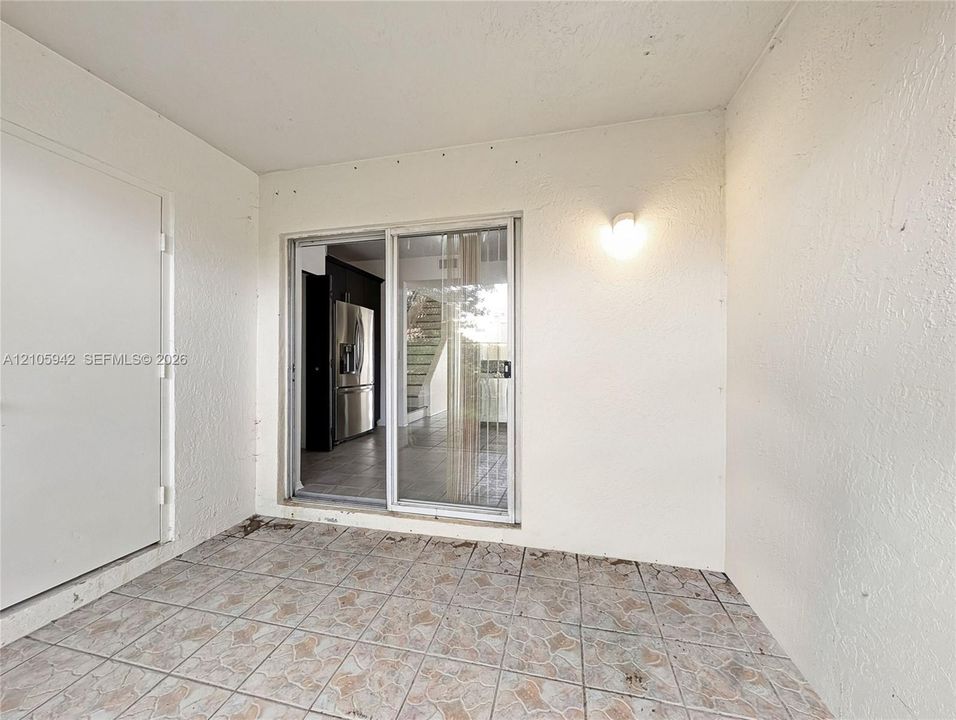 Screened-in porch featuring tiled flooring