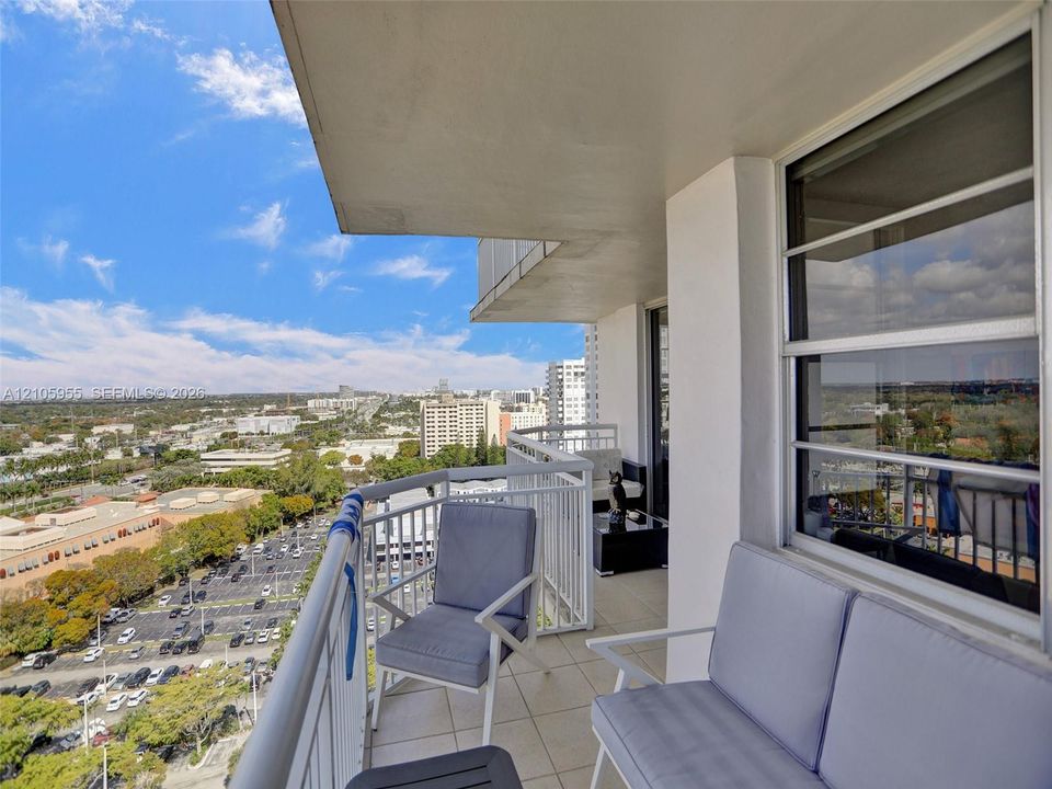 Private balcony featuring tile flooring and white metal railings