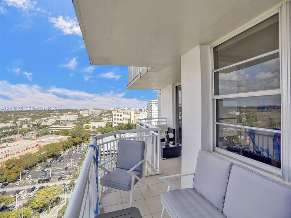 Private balcony featuring tile flooring and white metal railing