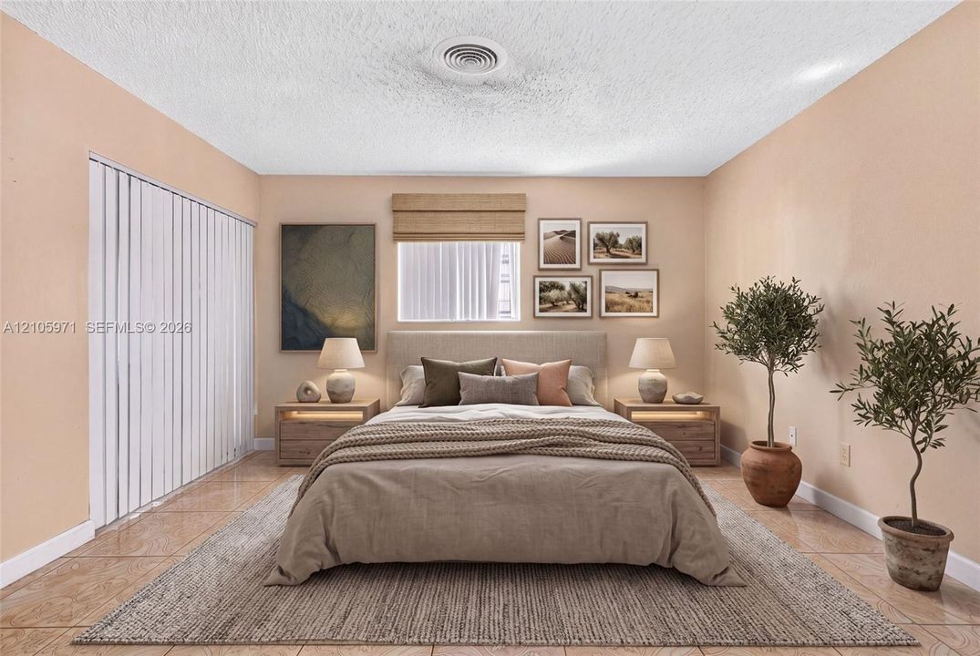 Neutral-toned interior featuring ceramic tile flooring, vertical window blinds, and a roman shade