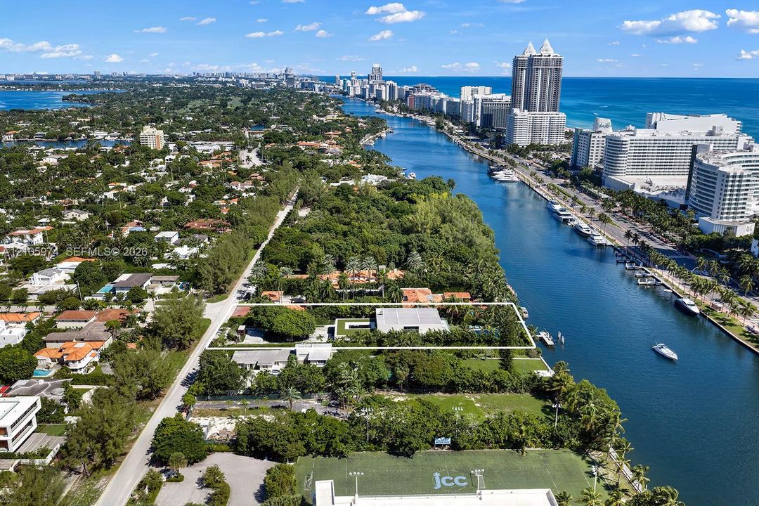 Waterfront property featuring deep-water access, a private dock, and an expansive lawn
