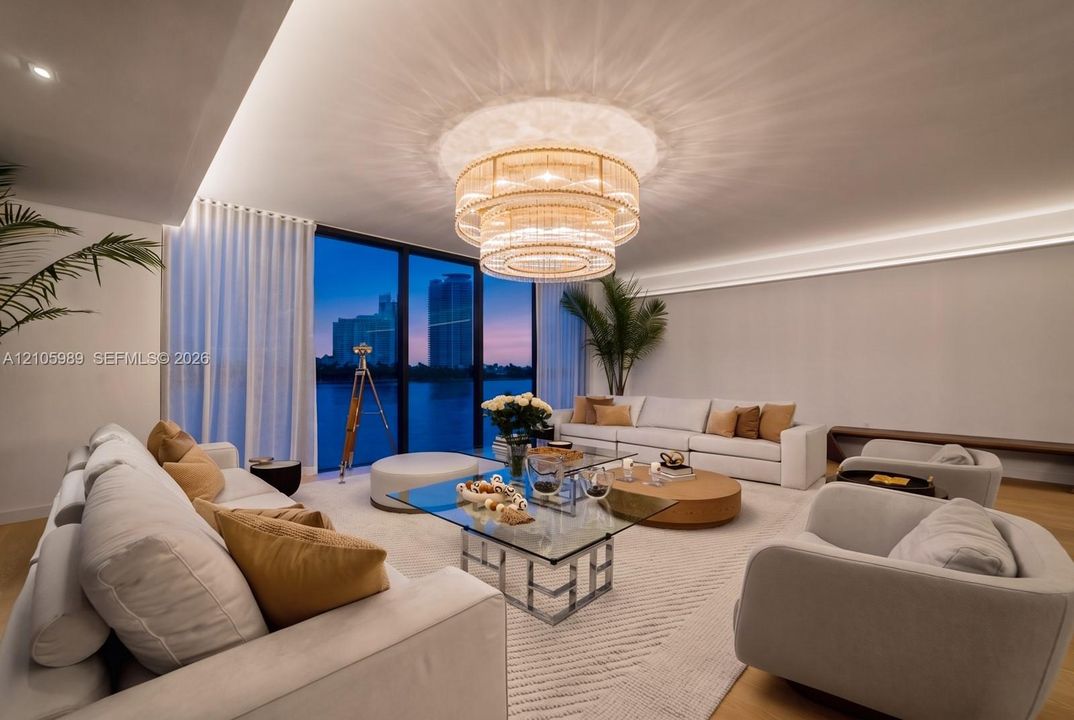 Floor-to-ceiling glass wall, multi-tiered crystal chandelier, recessed cove lighting, and wood-finish flooring