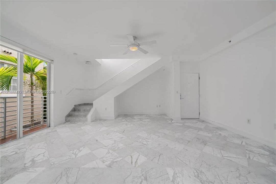 section under stairs is currently closed into a closet for convenient storage!