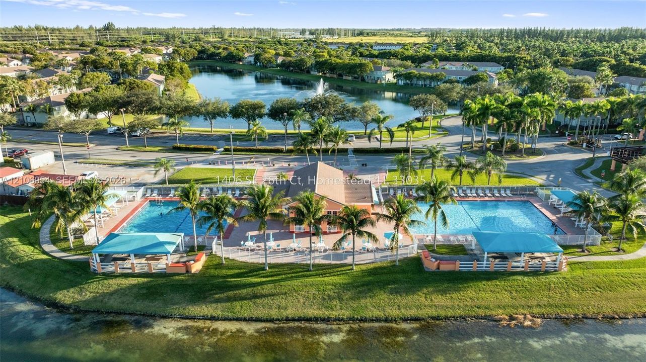 Community amenities featuring two swimming pools, covered outdoor pavilions, a clubhouse, and a waterfront setting