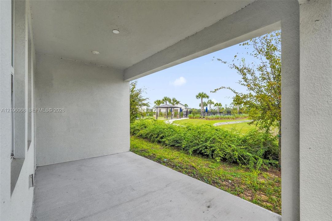Covered concrete patio featuring recessed lighting and a stucco ceiling