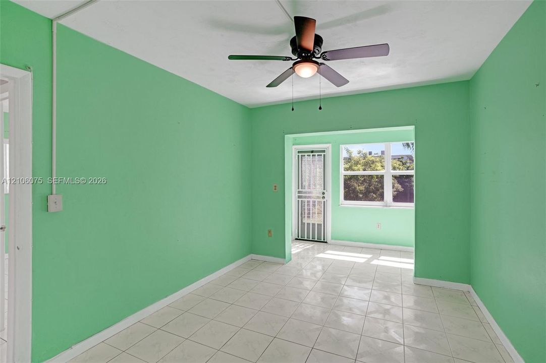 Tile flooring, ceiling fan with integrated light fixture, and screen-secured exterior door