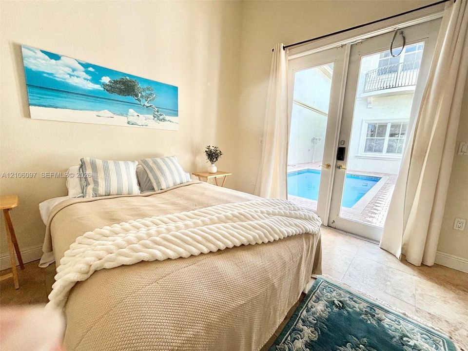 Guest house bedroom overlooking the pool