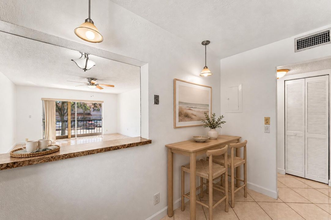 Coastal pass-through kitchen with oak ba