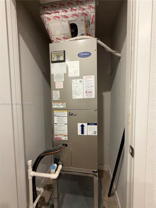 Carrier heating and cooling air handler unit housed within a dedicated utility closet