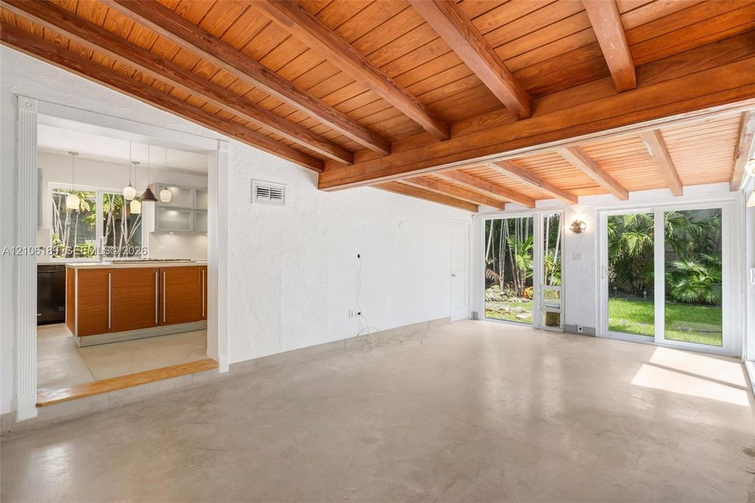 witha view of the kitchen and the garden trough the large sliging windows