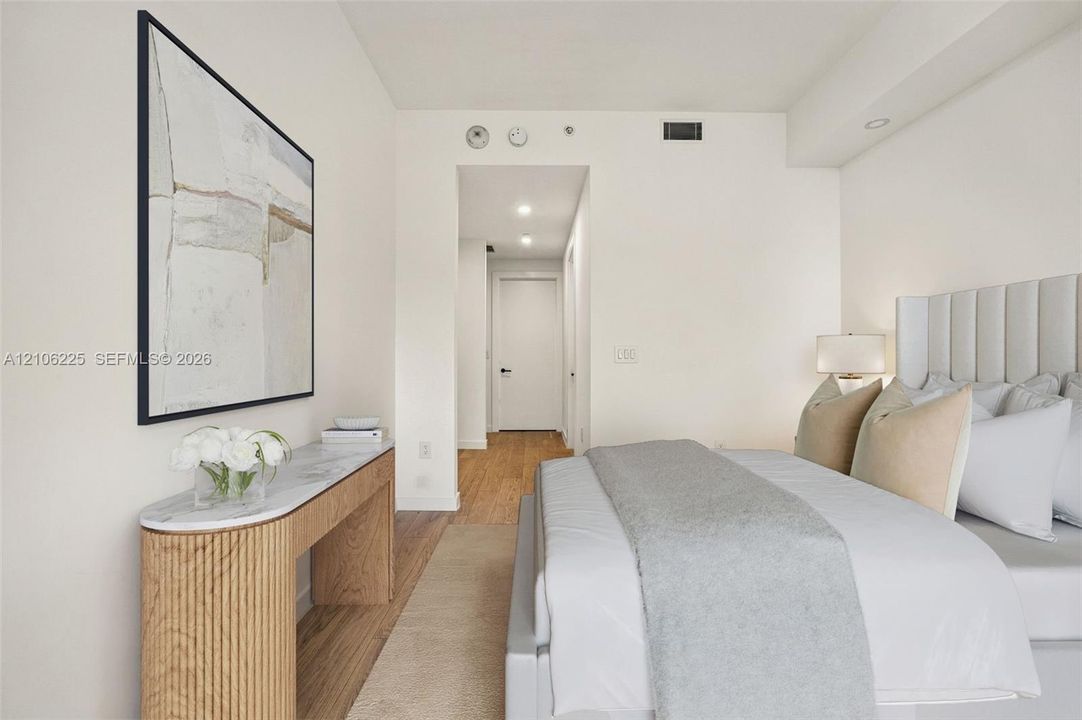 Neutral interior featuring recessed lighting, wood-finish flooring, and a smooth ceiling finish