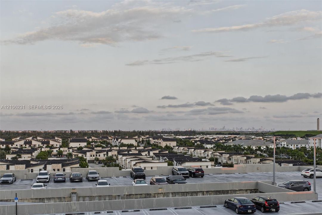 Multi-level parking structure with designated parking stalls and concrete masonry walls