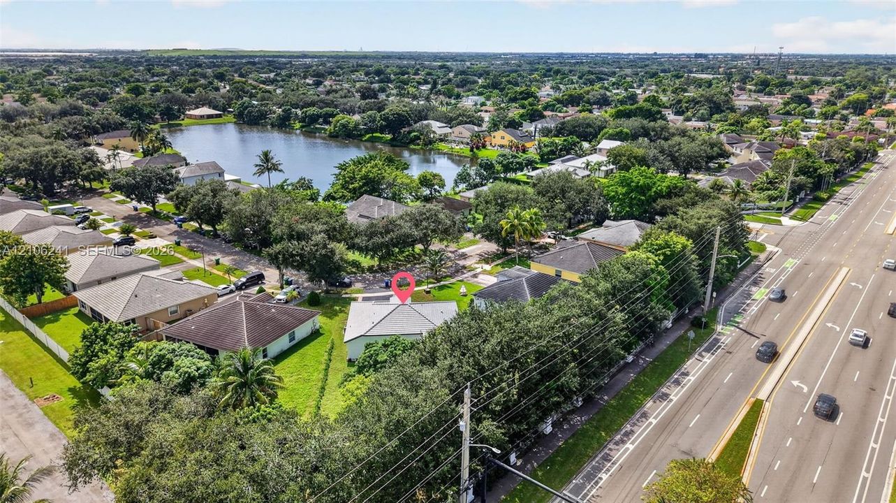Aerial perspective of a single-story residence featuring a hipped roof and a dedicated lawn area
