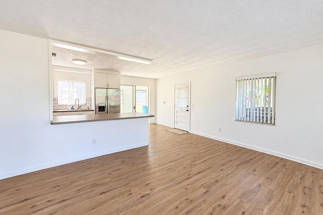 Bright Empty Open-Plan Kitchen and Livin