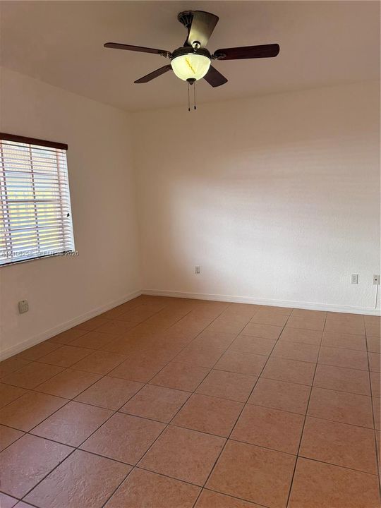 1st bedroom with view to the parking