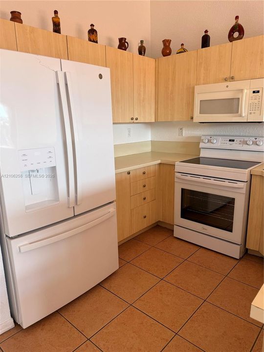 brand new refrigerator and e-range.