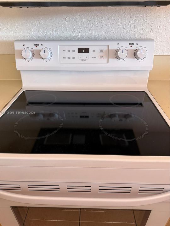 brand-new electric range with oven.