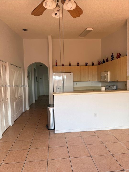 view of the kitchen and hall from the family room.