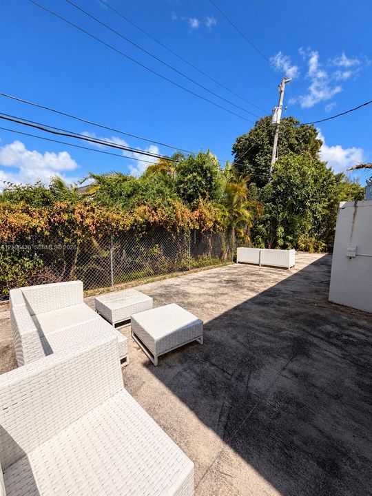 Shared backyard space with laundry connections.
