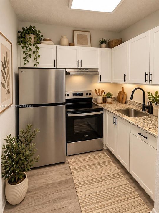 Kitchen featuring white cabinetry with matte black hardware, stone-finish countertops, stainless steel refrigerator, electric range, and under-cabinet lighting Edit with IA