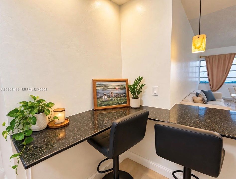 Built-in stone-surface desk and counter, and a pendant light fixture