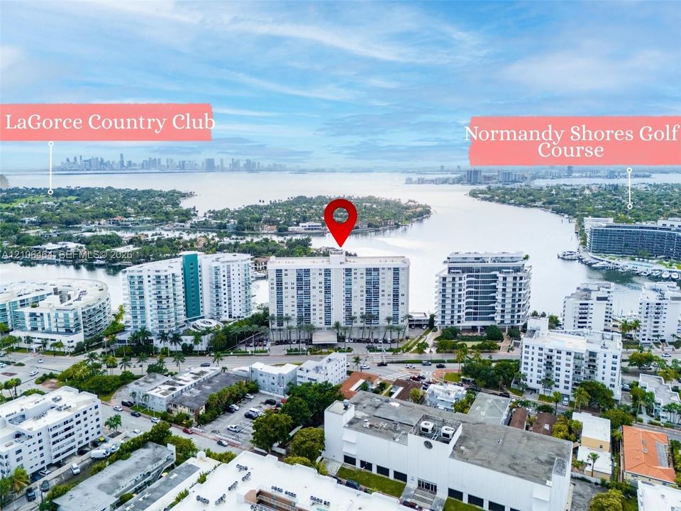 Additional contentThe image is an aerial photograph showing the surrounding neighborhood context (waterfront, golf course, country club, and cityscape) rather than the primary subject property itself