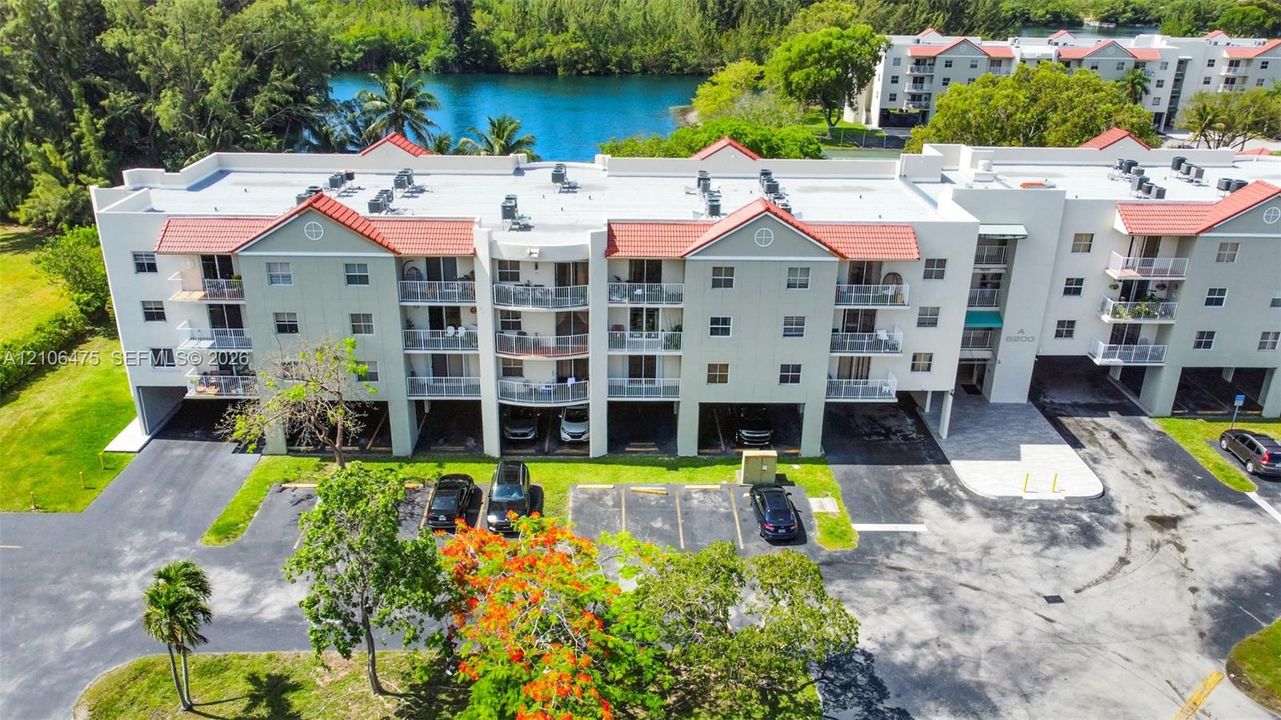 Private covered balconies, ground-level covered parking, and direct waterfront
