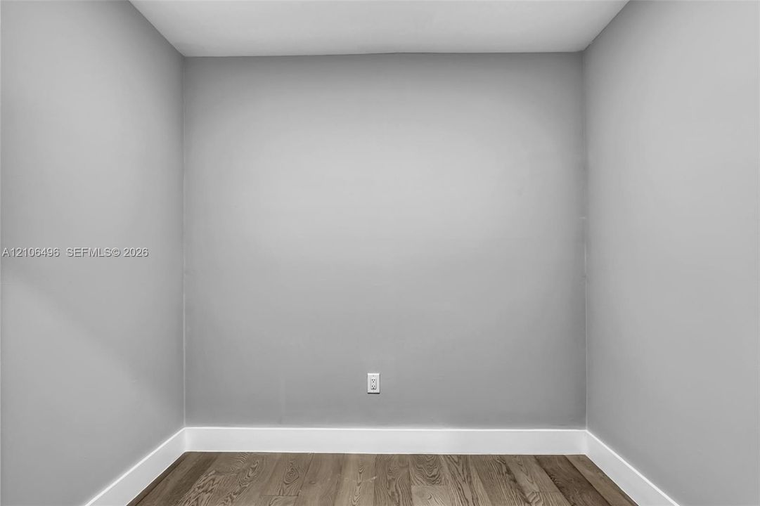 Neutral-toned walls and wood-finish flooring