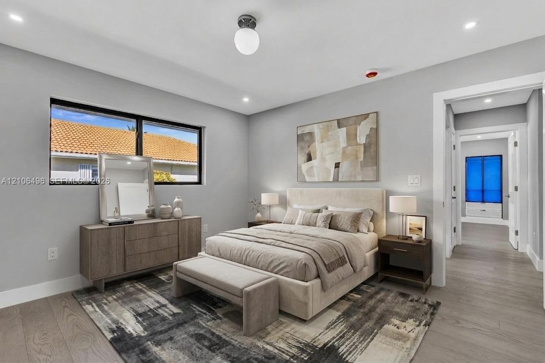 Neutral-toned interior featuring wood-finish flooring, recessed lighting, a modern globe-style ceiling fixture, and a large window with black frames