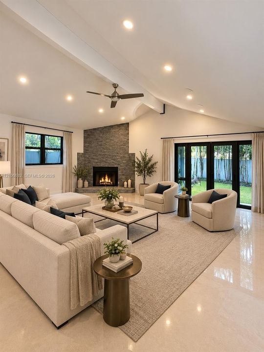 AI enhanced. Vaulted ceiling featuring recessed lighting, stacked-stone fireplace with a raised hearth, multi-panel glass doors, and polished stone flooring