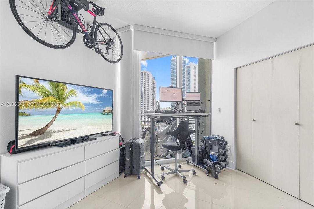 Second bedroom with access to the balcony and custom-made closet