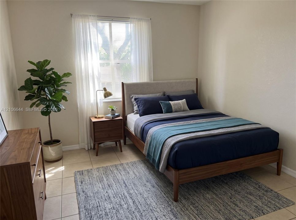 Neutral-toned wall finish, ceramic tile flooring, and a window with horizontal blinds