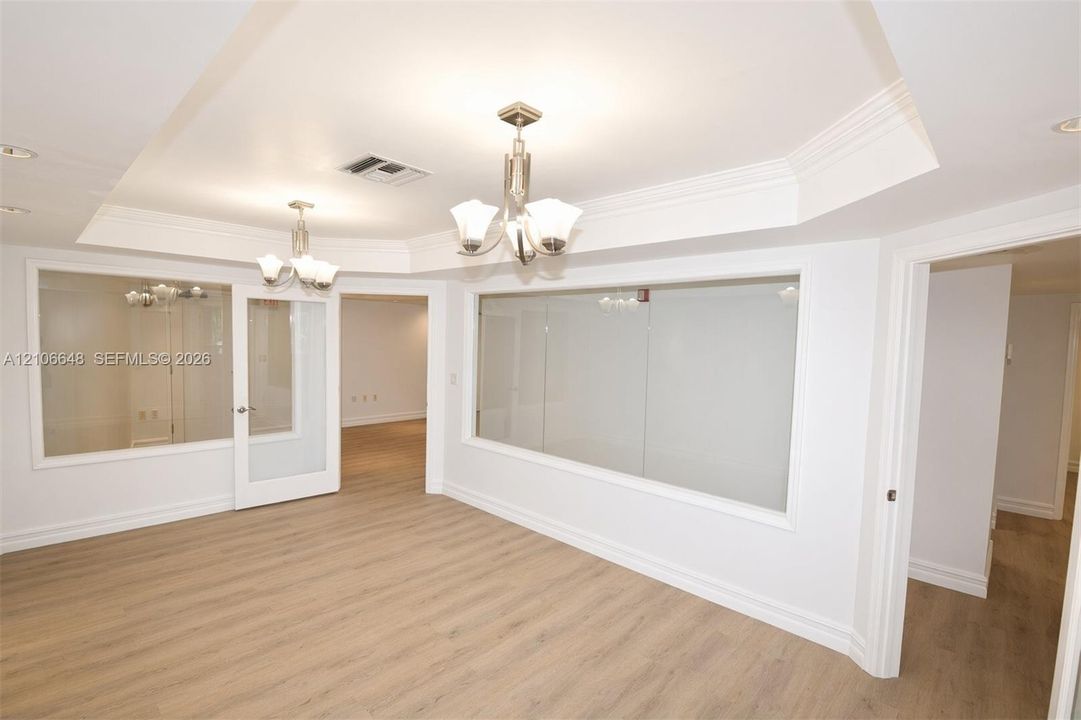Conference Room Tray ceiling featuring crown molding,