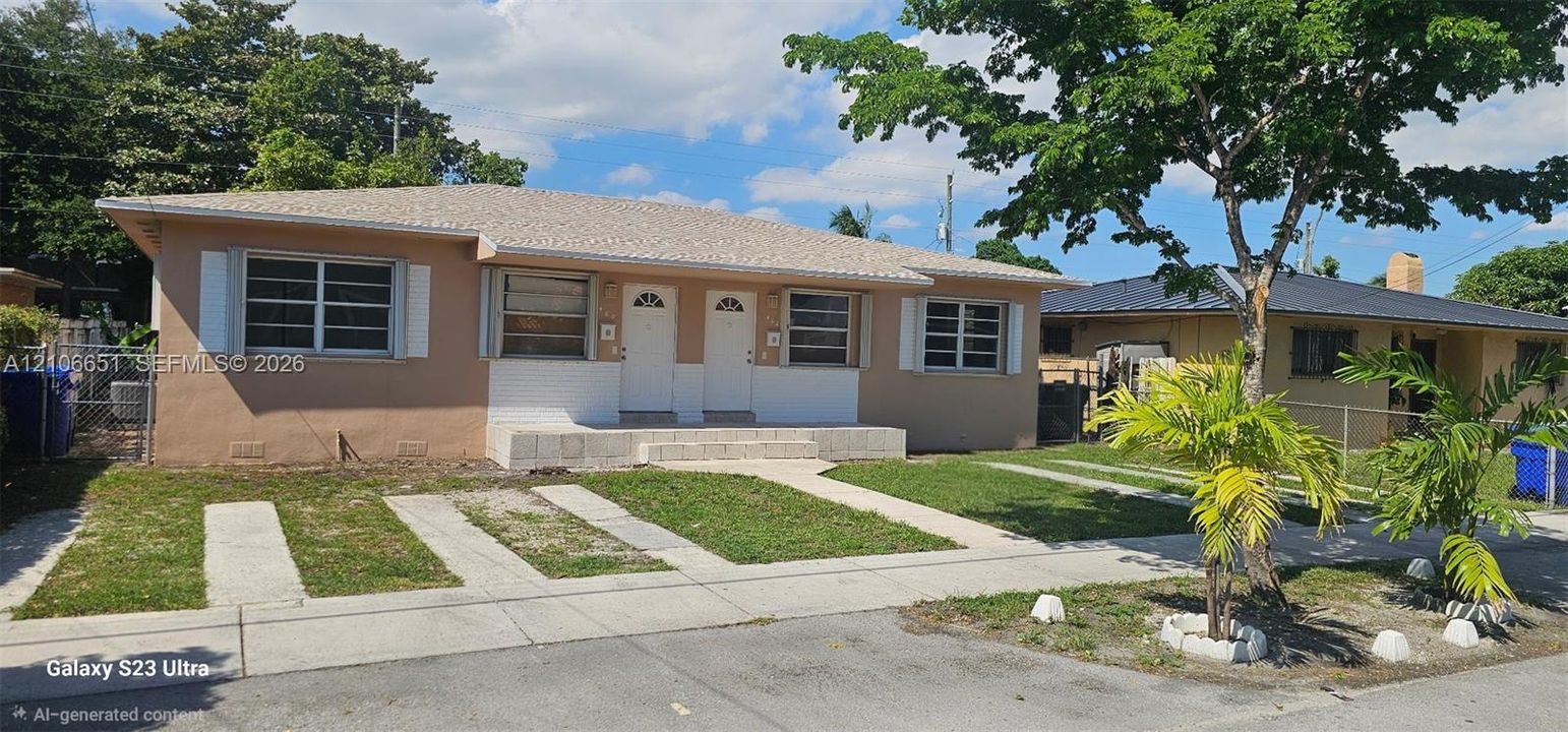 Single-story exterior featuring a hip roof, dual entry doors, light-toned stucco facade, decorative window shutters, and a concrete driveway