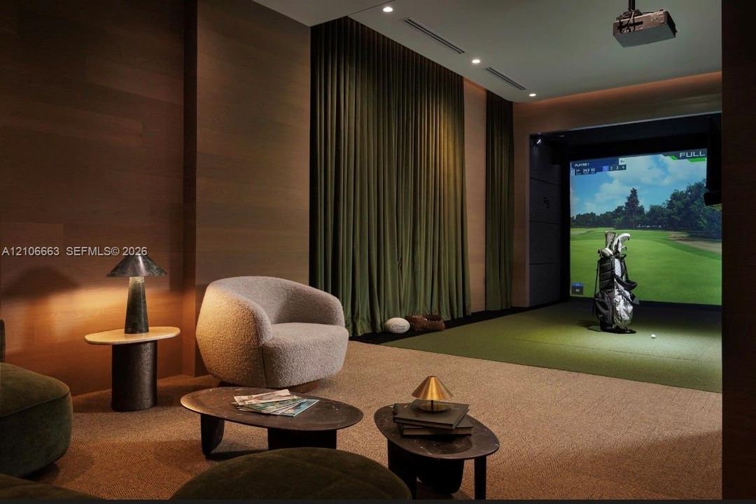 Integrated golf simulator room featuring wood-paneled walls, floor-to-ceiling drapery, recessed lighting, and a specialized athletic flooring surface