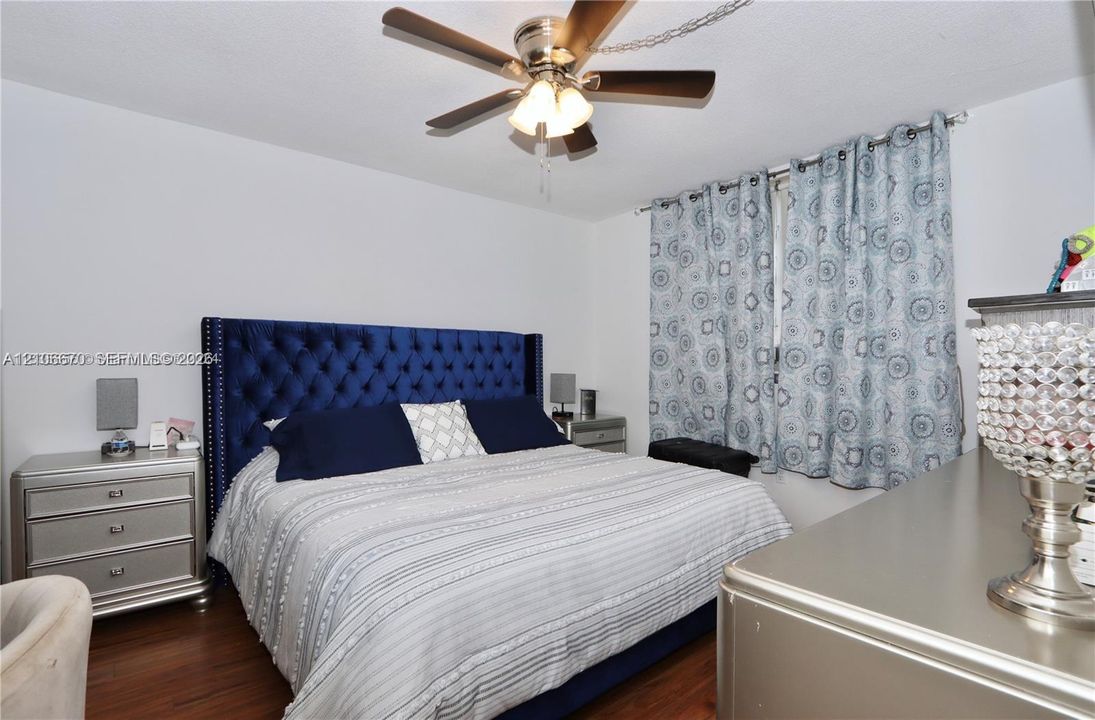 Wood-finish flooring and a ceiling fan with integrated lighting