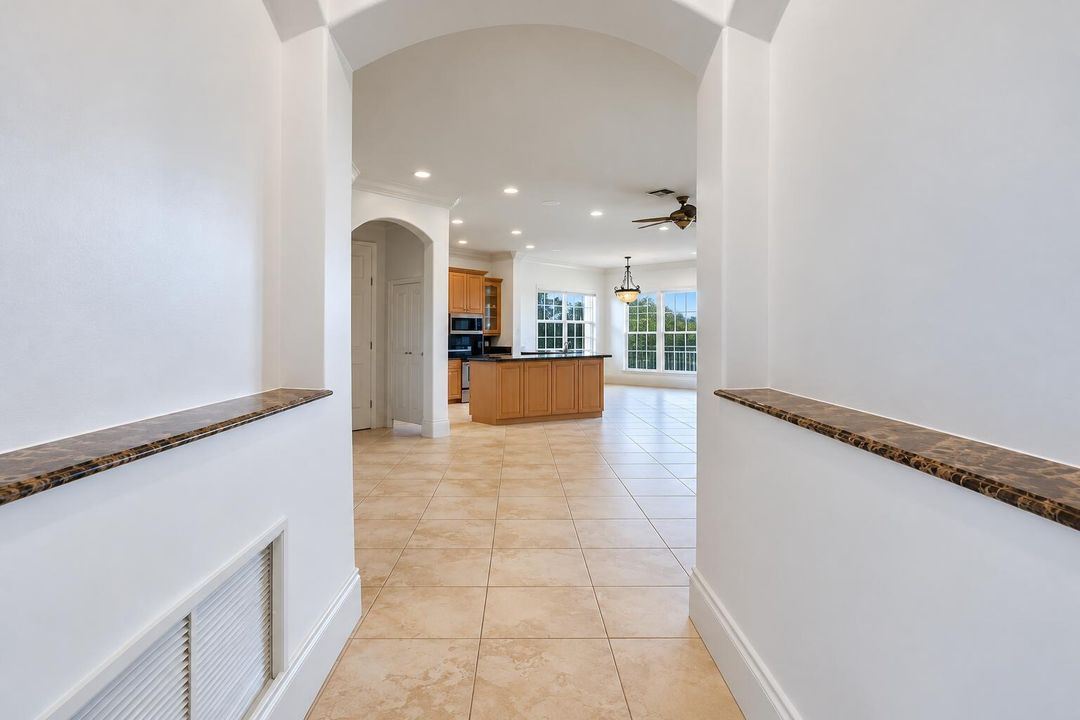Symmetrical Modern Foyer and Open Kitche