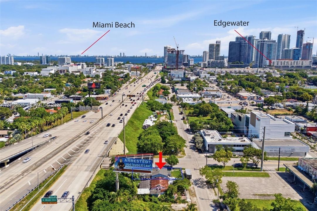 Aerial perspective of a property lot featuring proximity to major thoroughfares, regional highway infrastructure, and urban density