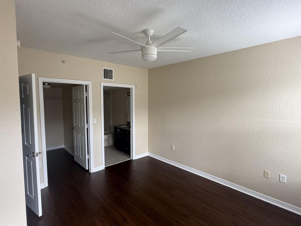 Primary bedroom and bathroom