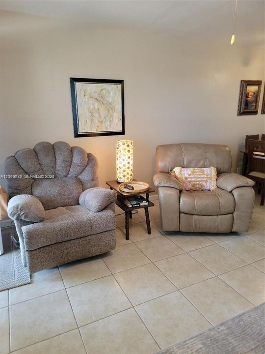 Neutral-toned wall paint and large-format ceramic tile flooring