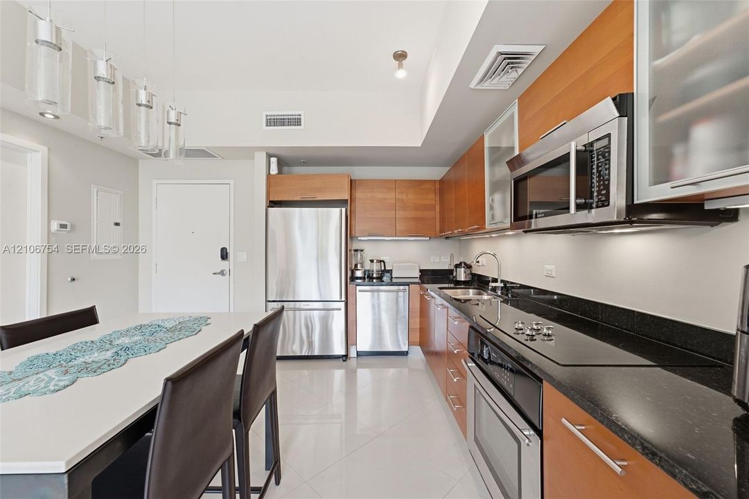 Kitchen featuring wood cabinetry, stainless steel appliances