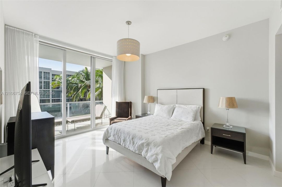 Floor-to-ceiling glass windows and balcony