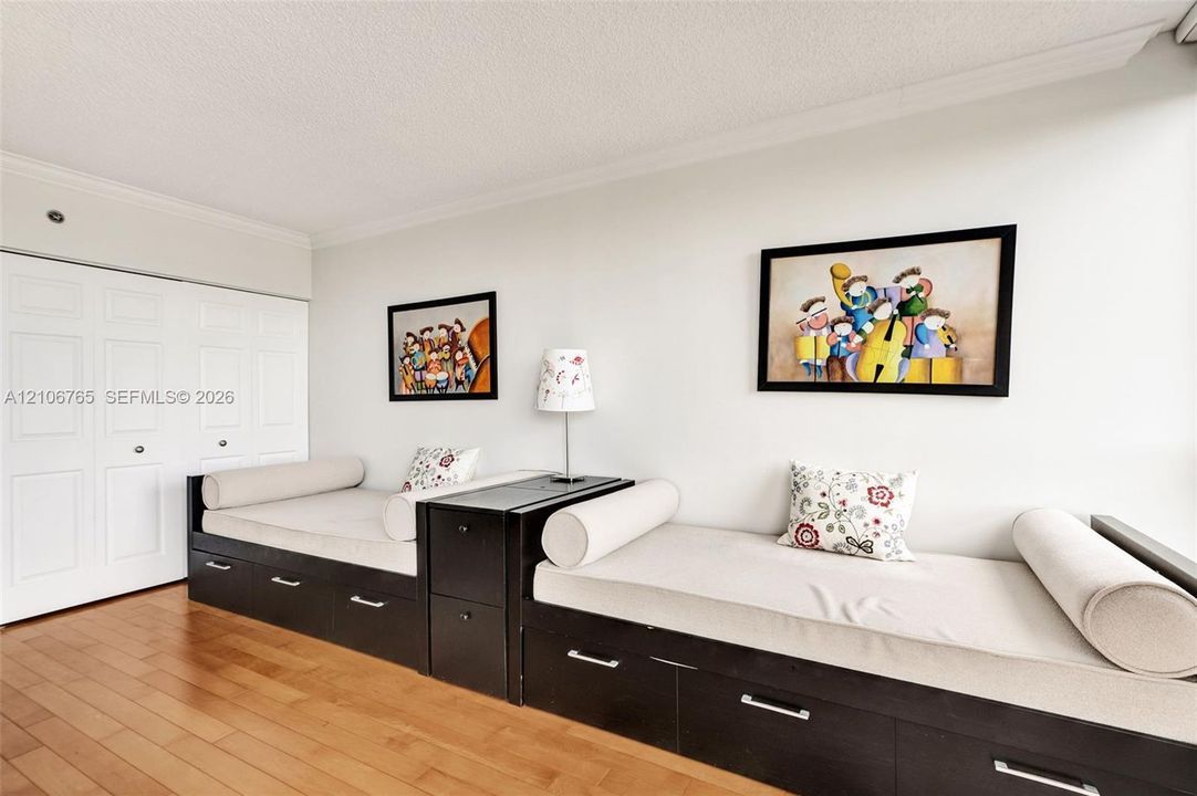 Large second bedroom, white paneled double-door closet.