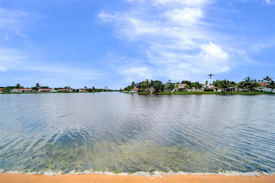 Waterfront lot featuring a stone-reinforced shoreline and expansive water frontage