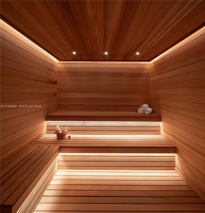 Custom-built sauna featuring tongue-and-groove wood paneling, multi-level tiered benches, recessed ceiling lighting, and integrated linear LED accent illumination