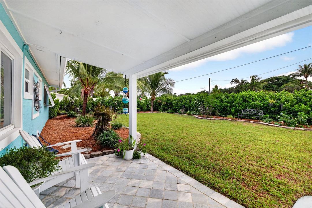 Large front yard with privacy hedge