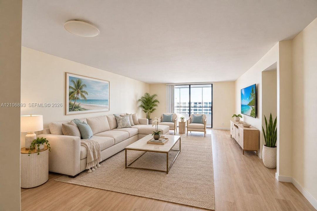 Spacious living area featuring wood-finish flooring and large sliding glass doors leading to an exterior balcony