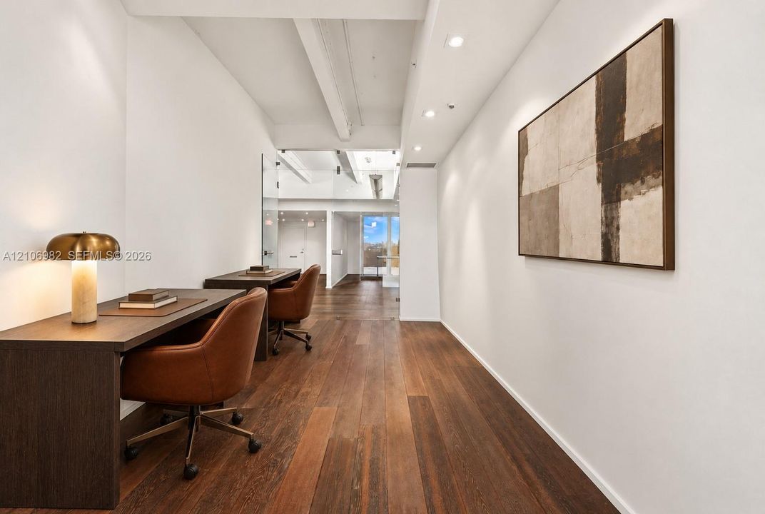 Wood-finish flooring, recessed ceiling lighting, and structural exposed ceiling beams