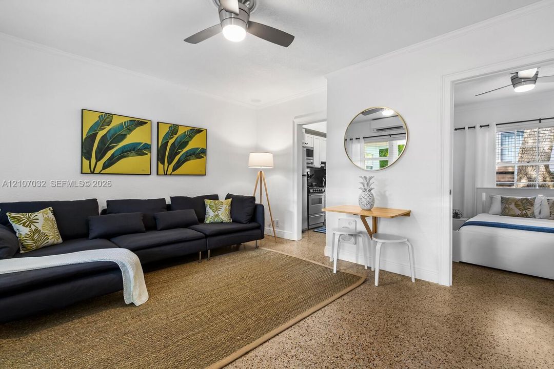 Interior space featuring polished terrazzo flooring, neutral wall finishes, and integrated ceiling fans