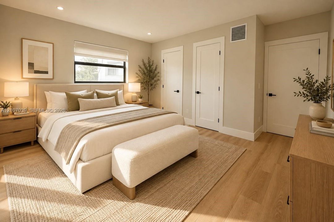 Wood-finish flooring, recessed lighting, and solid-core interior doors with matte black hardware